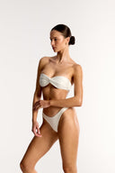 Ivory Azura twist bandeau bikini top and high cut bottoms on model, Bailee Swim
